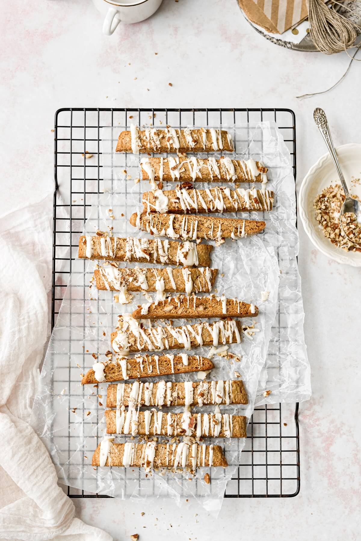 Butter pecan biscotti on a black cooling rack.
