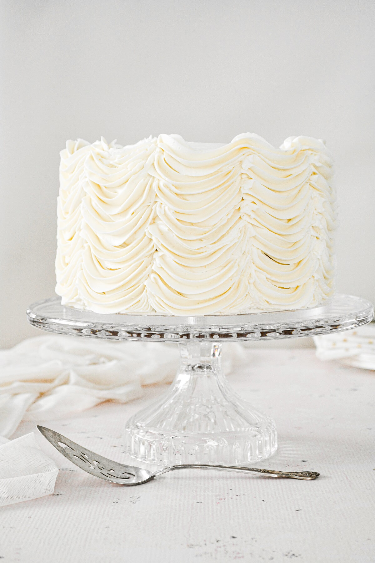 Cardamom cake with piped swoops of eggnog buttercream.