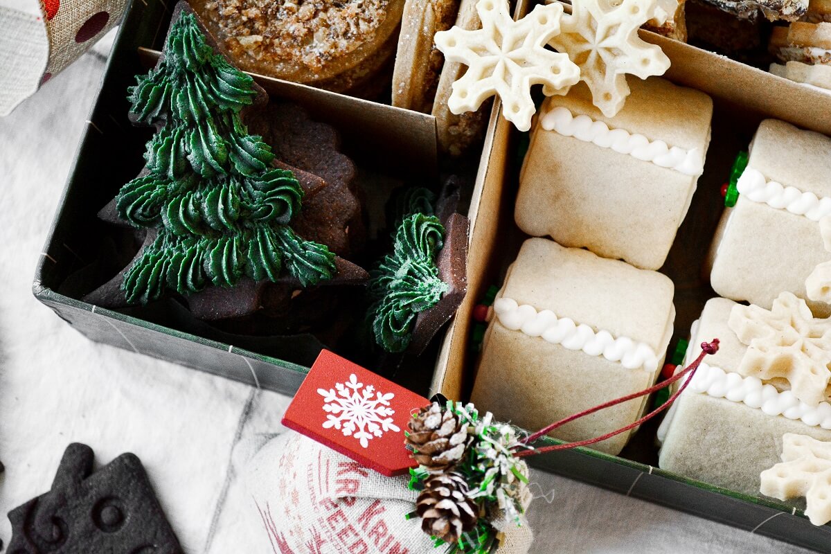 A box full of assorted Christmas cookies.