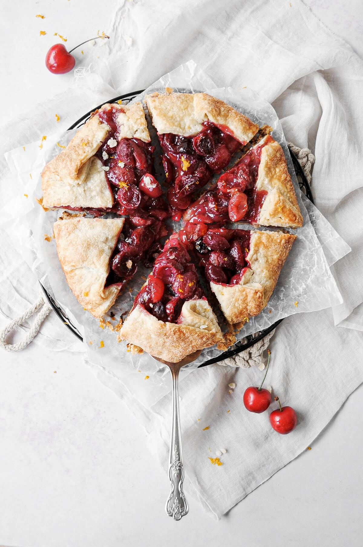 Cherry galette cut into six wedges.