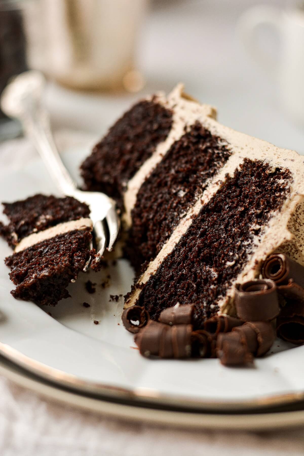 Chocolate espresso cake with coffee buttercream and chocolate curls.