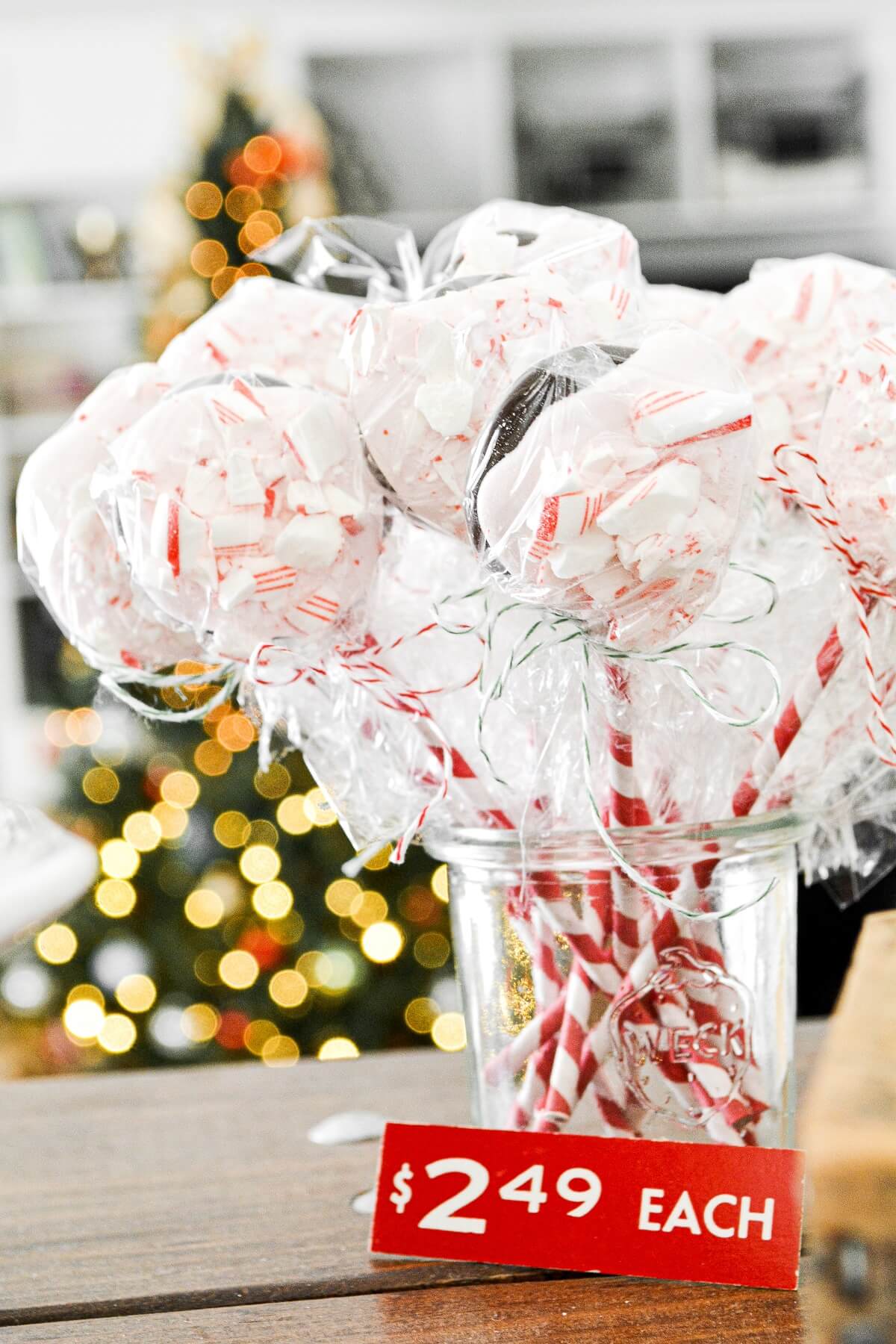 Peppermint bark pops on red and white striped sticks.