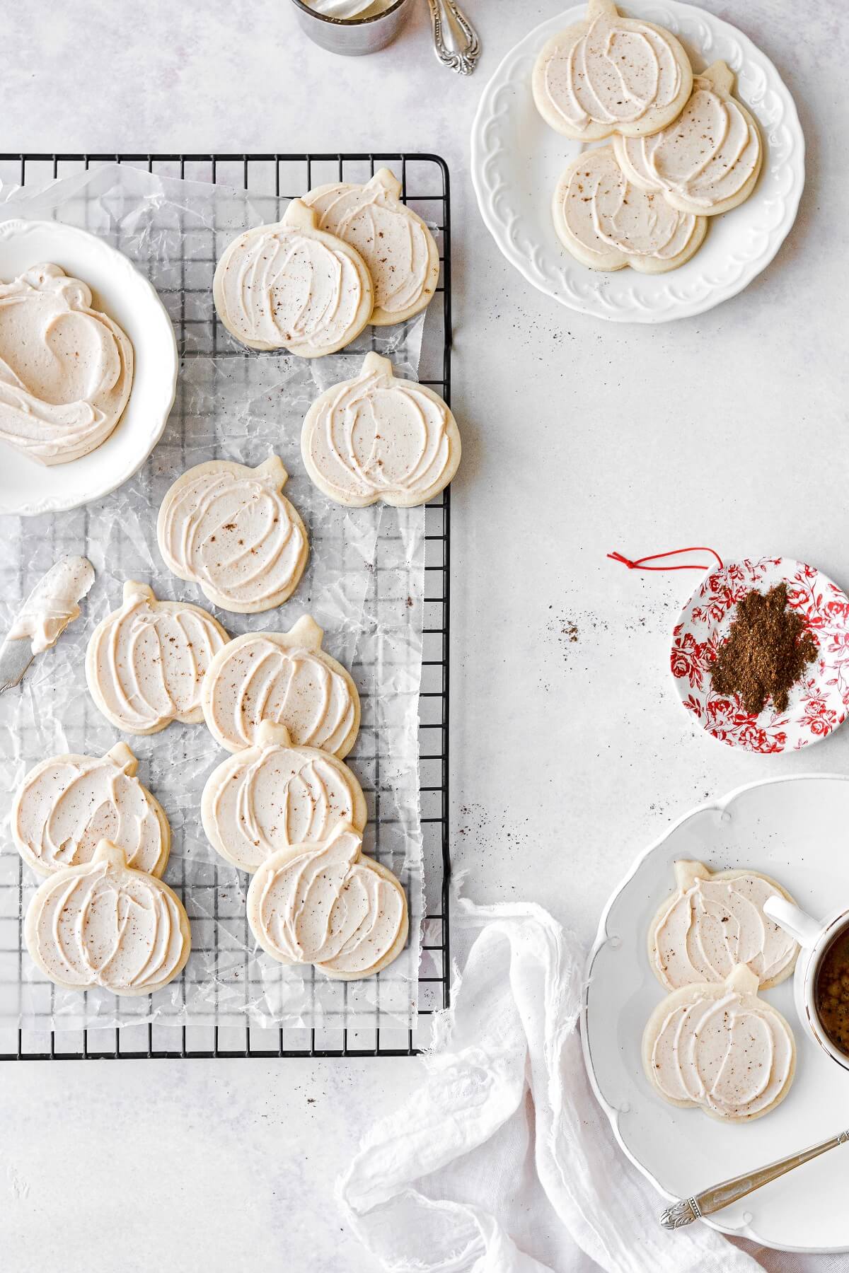 Pumpkin sugar cookies with maple frosting, dusted with nutmeg.