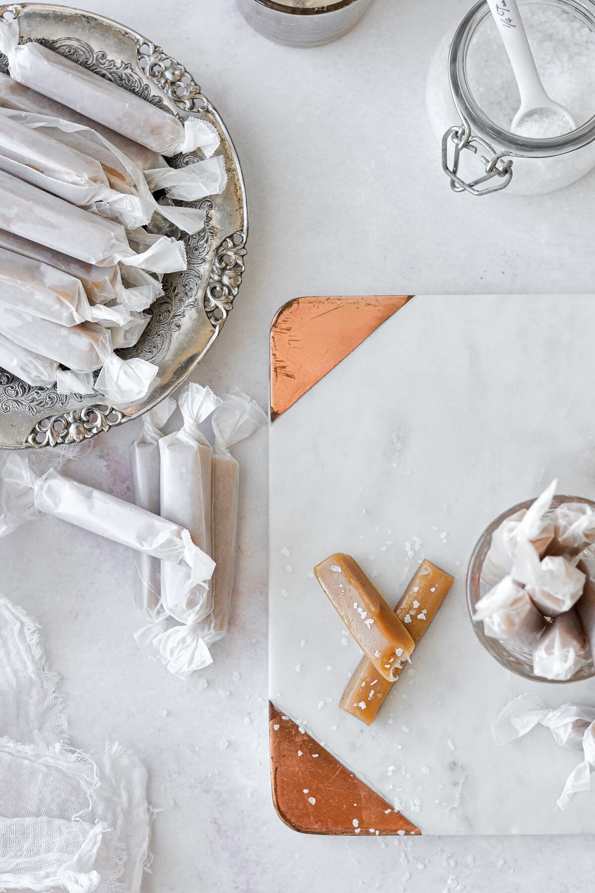 Soft salted vanilla caramels on a marble cutting board.