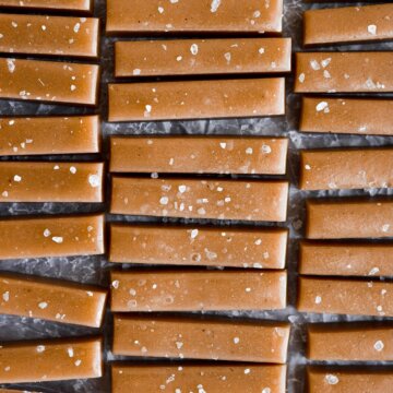 Vanilla salted caramels on wax paper.