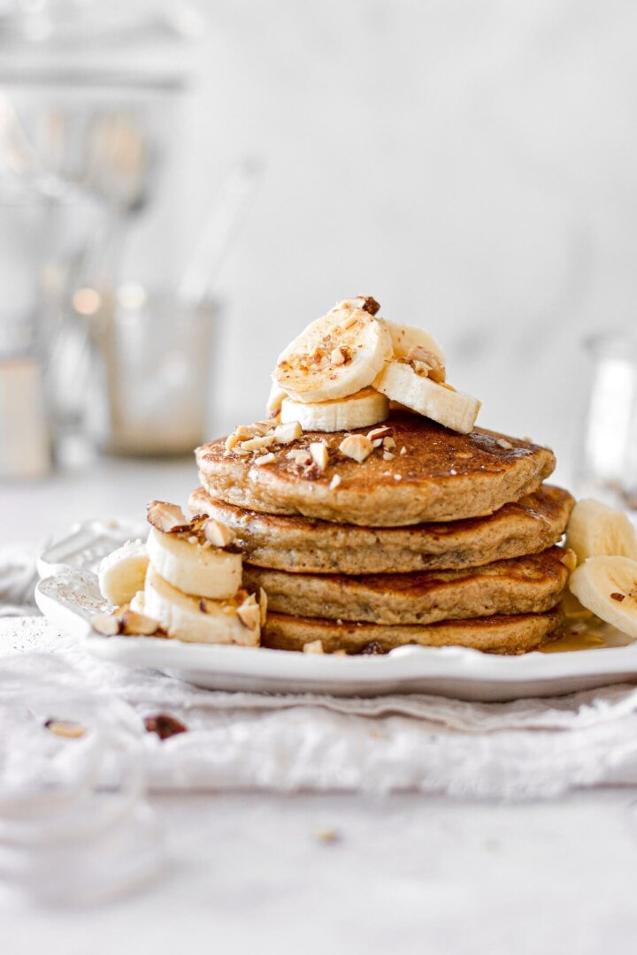 Banana bread pancakes, topped with bananas and almonds.