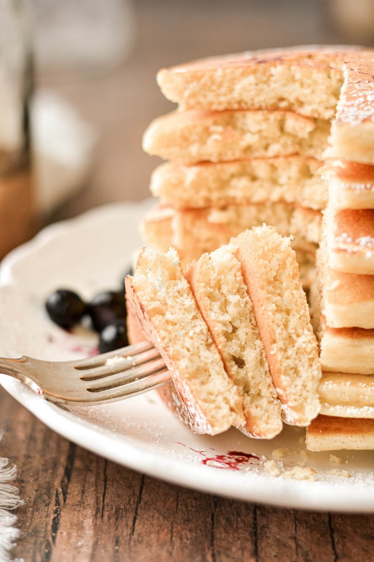 Classic fluffy pancakes, with a bite cut.