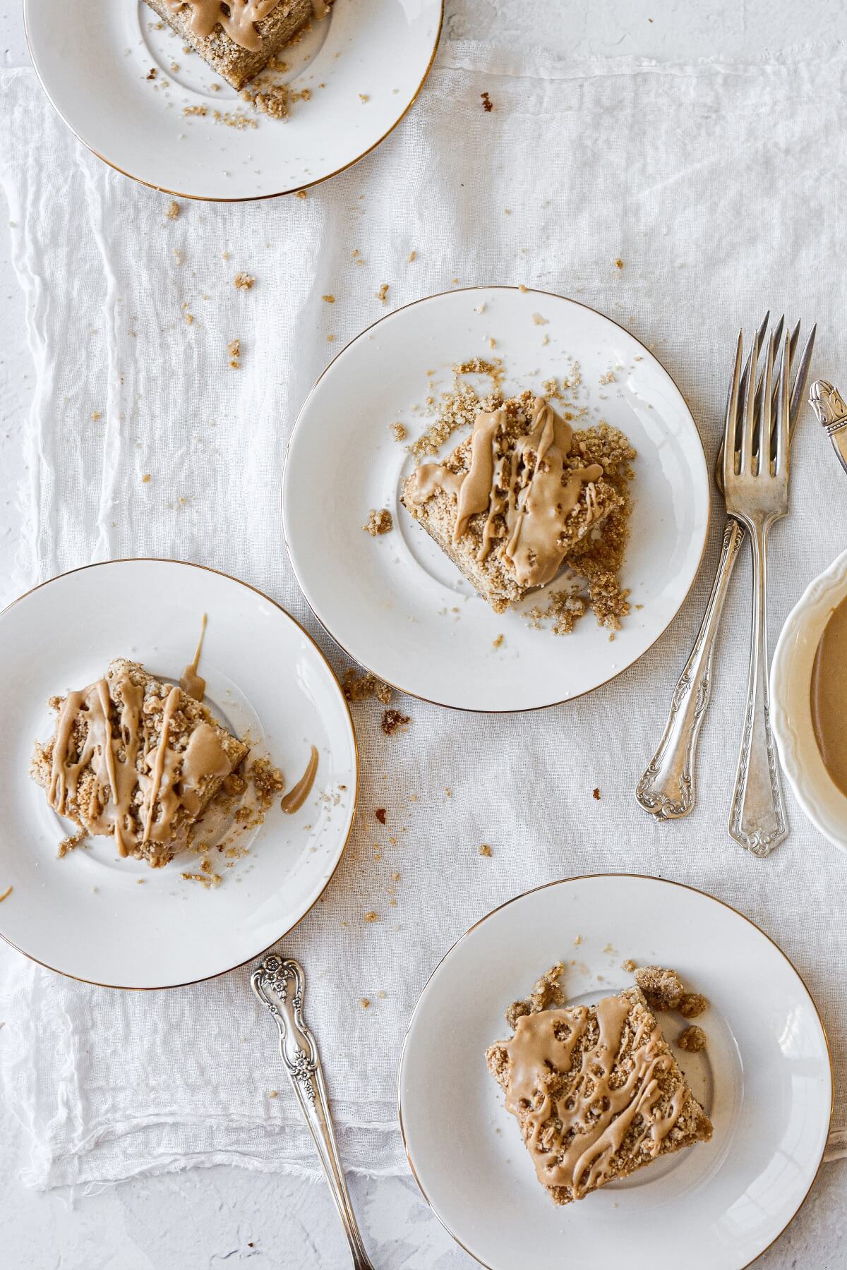 Pieces of gingerbread coffee cake, drizzled with maple icing.