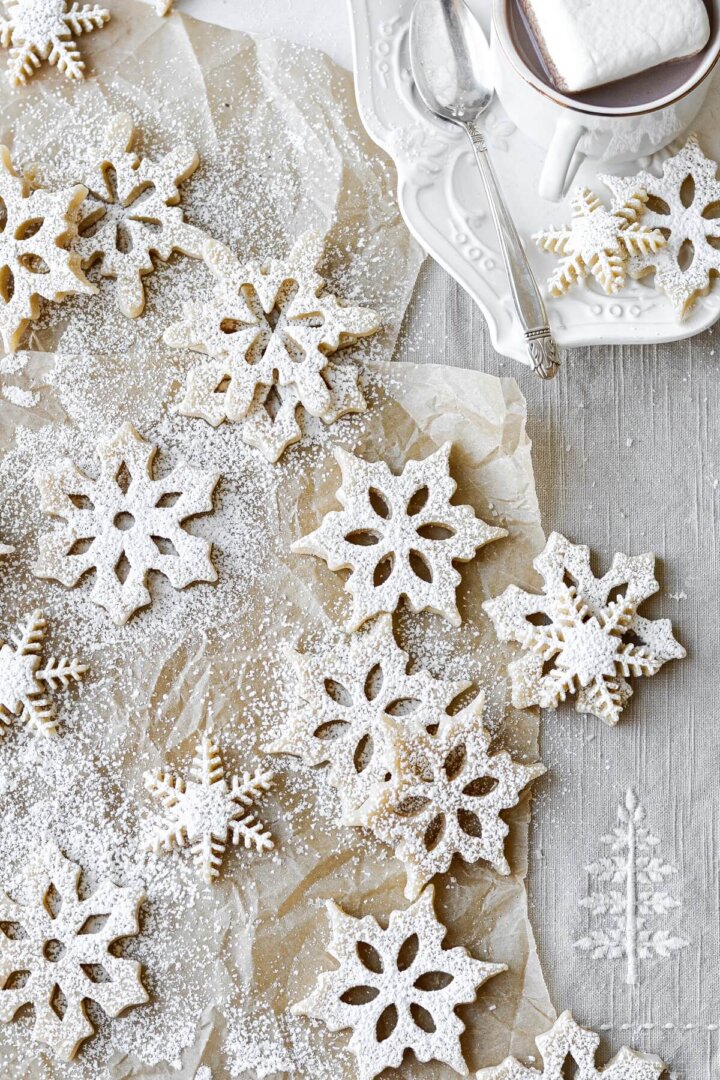 Snowflake shortbread cookies, dusted with powdered sugar.