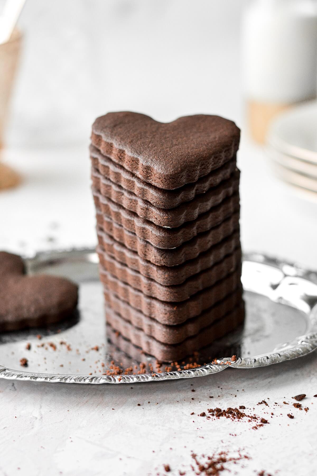 A stack of heart shaped chocolate sugar cookies.