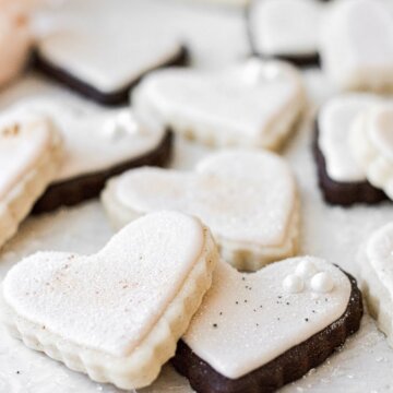 Heart shaped chocolate and vanilla sugar cookies, frosted with pale pink royal icing.