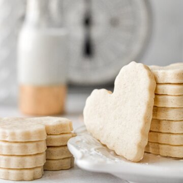 A stack of heart shaped vanilla bean sugar cookies.