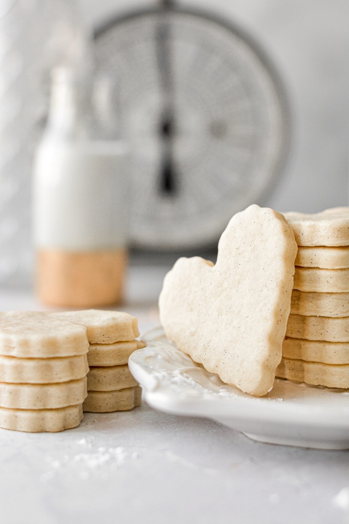 A stack of heart shaped vanilla bean sugar cookies.