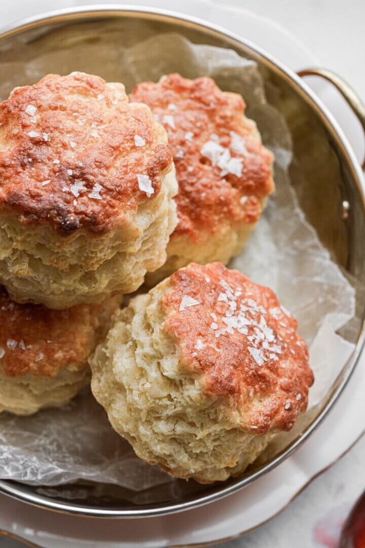 A bowl filled with baking powder biscuits.