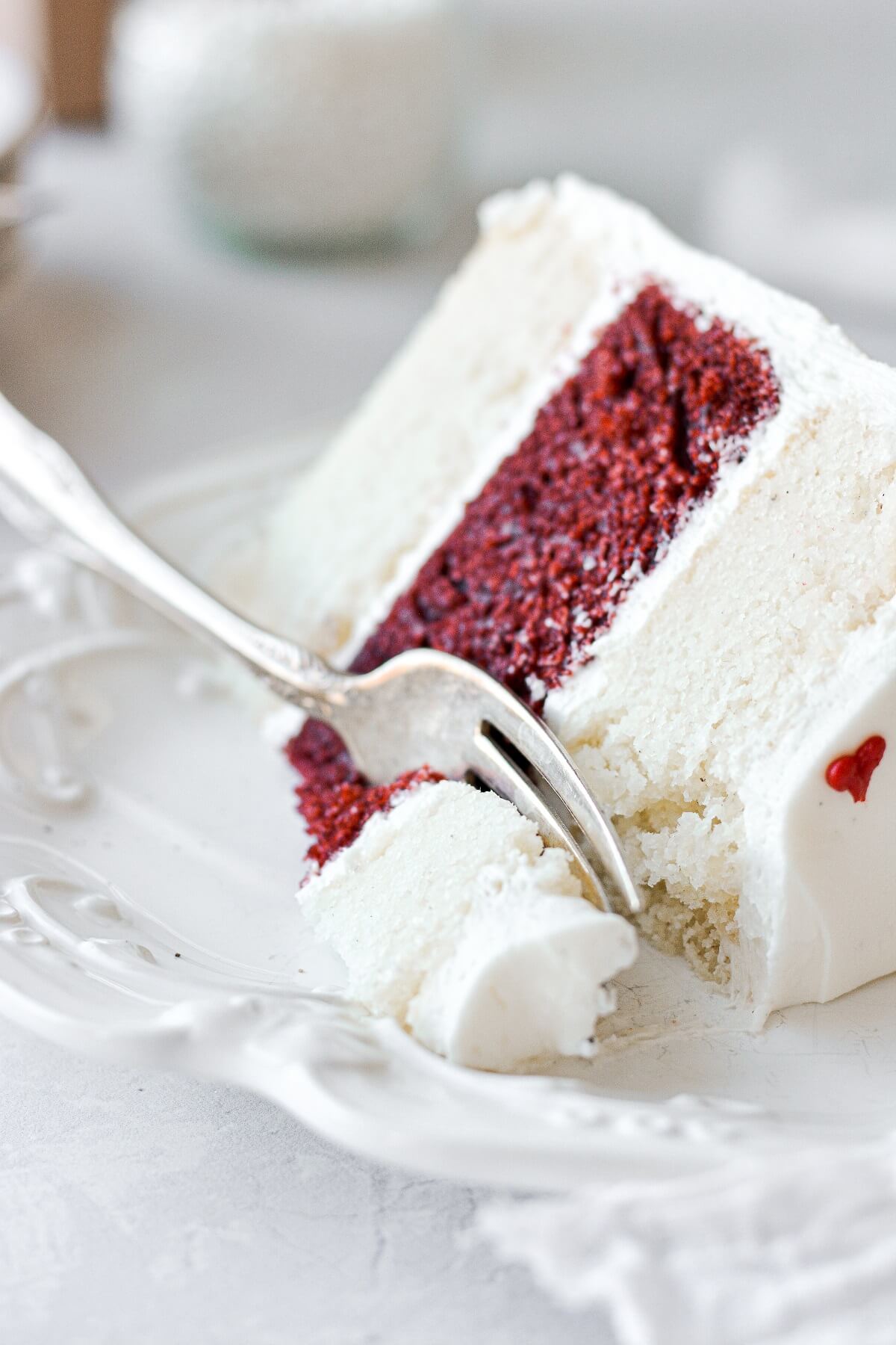 A slice of red and white striped cake for Valentines.