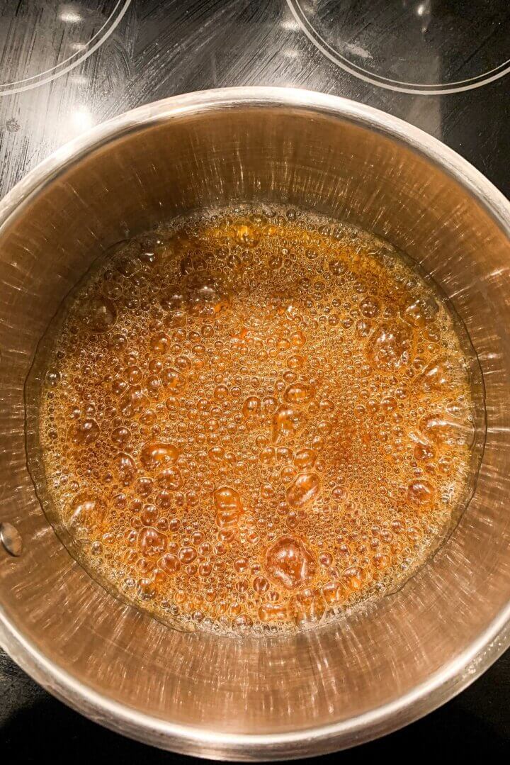 A pot of bubbling sugar to make caramel sauce.
