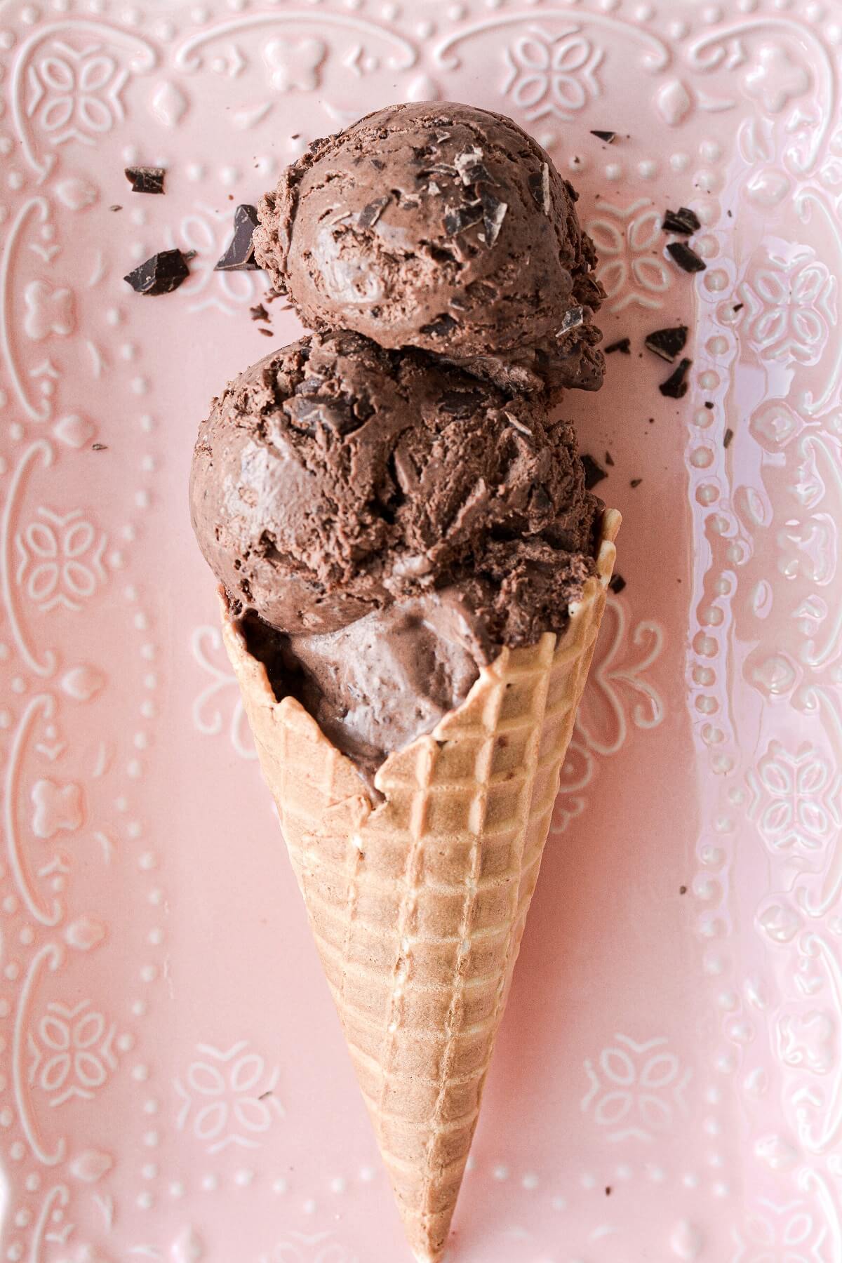 Scoops of no churn triple chocolate ice cream in a waffle cone.