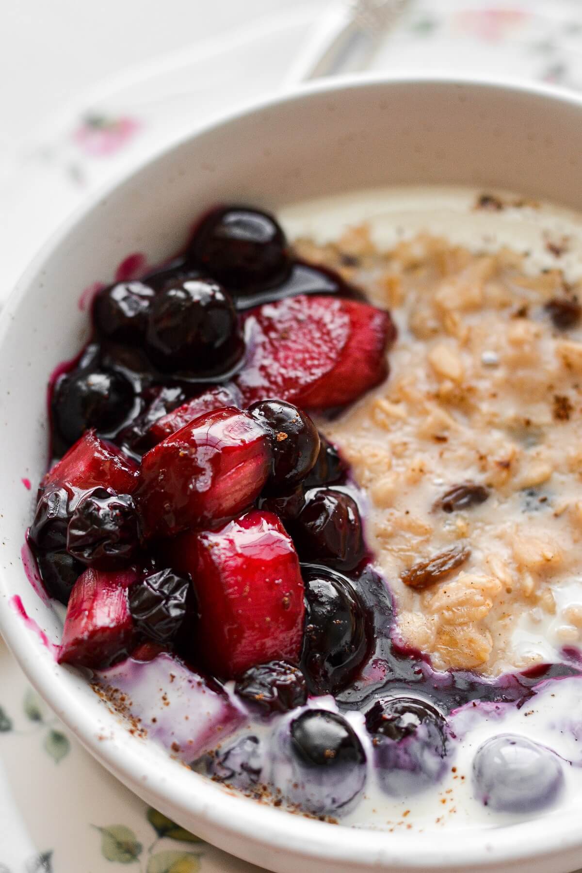 A bowl of oatmeal topped with blueberry rhubarb compote.