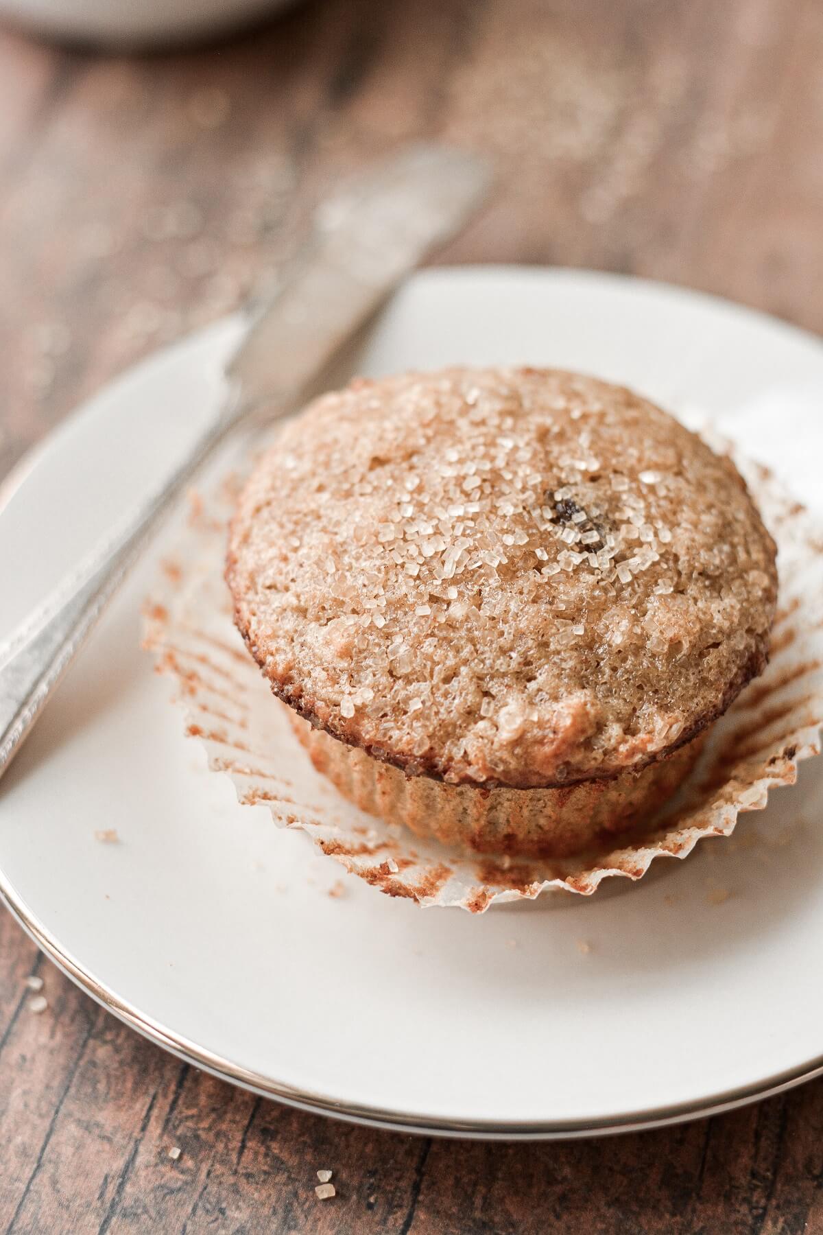 An oatmeal raisin muffin, sprinkled with coarse sugar.