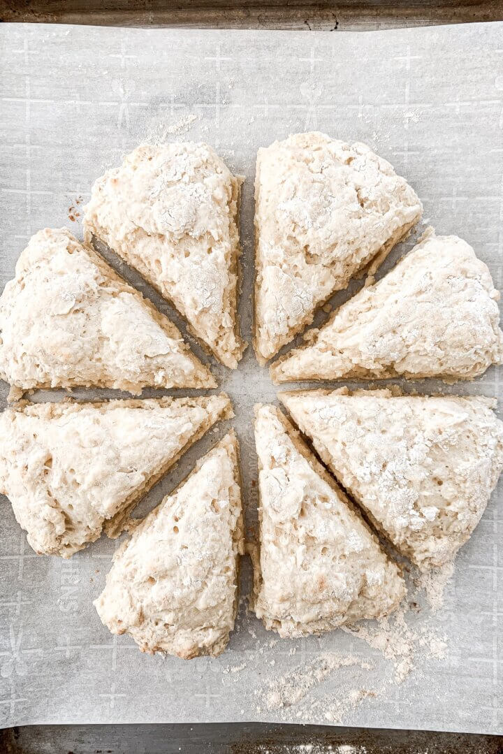Almond cream cheese scones on a baking sheet.