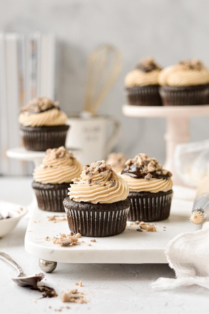 Chocolate truffle cupcakes, filled with ganache, topped with salted caramel buttercream and toffee bits.