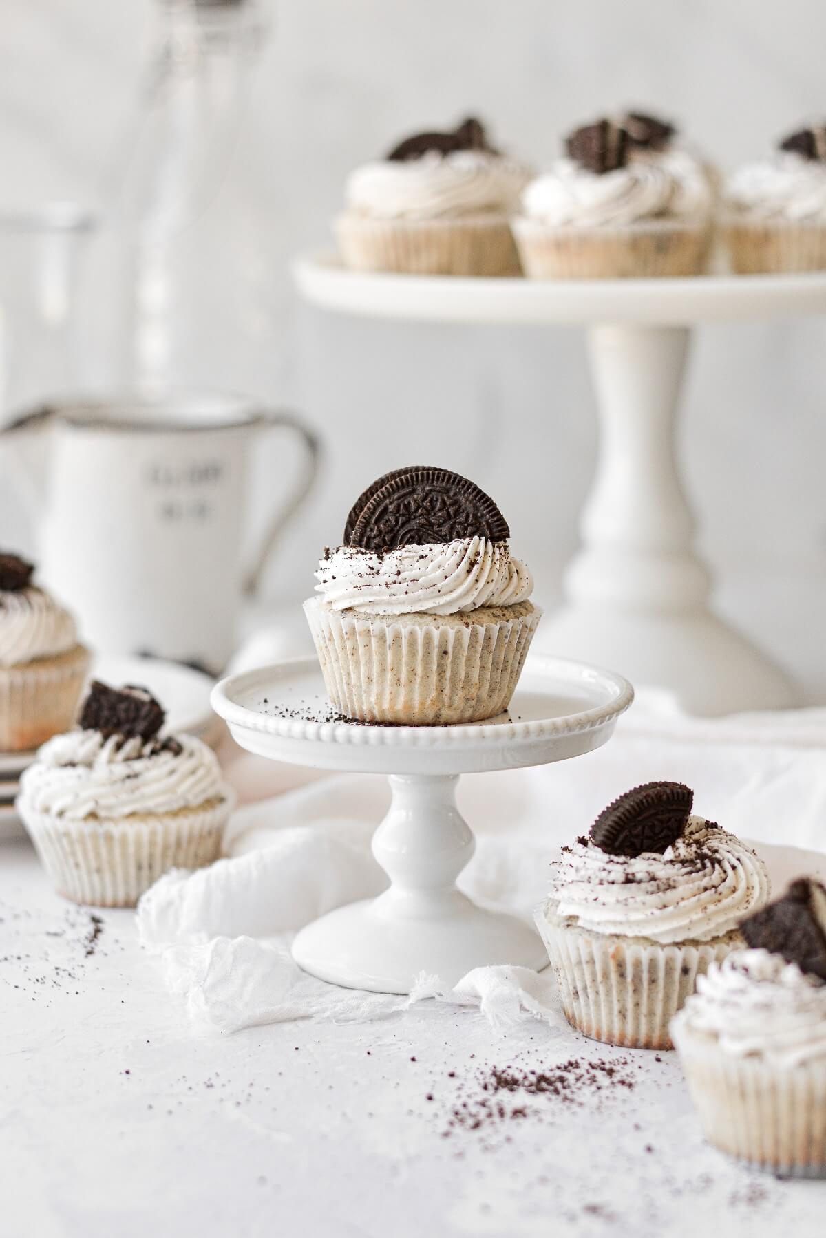 Cookies and cream cupcakes topped with Oreos.