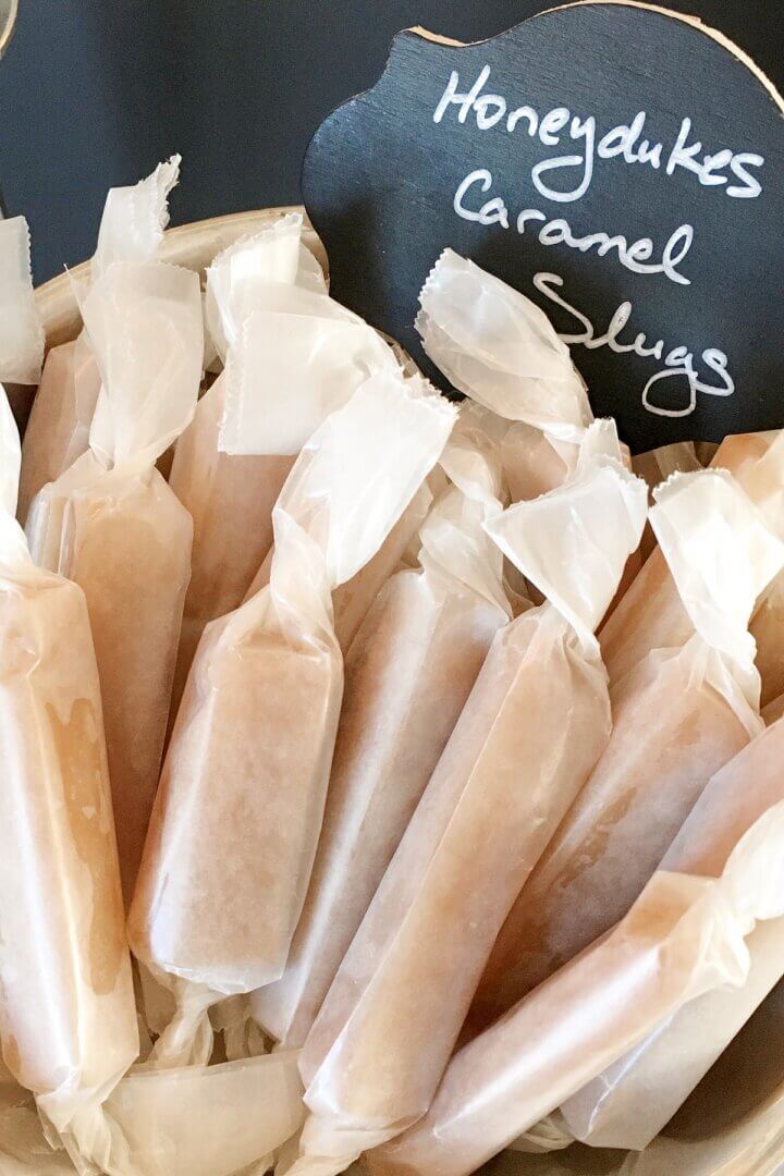 Salted caramels, wrapped in wax paper.