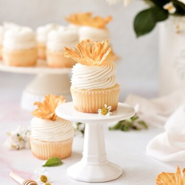 Honey lemon cupcakes topped with dried pineapple flowers.