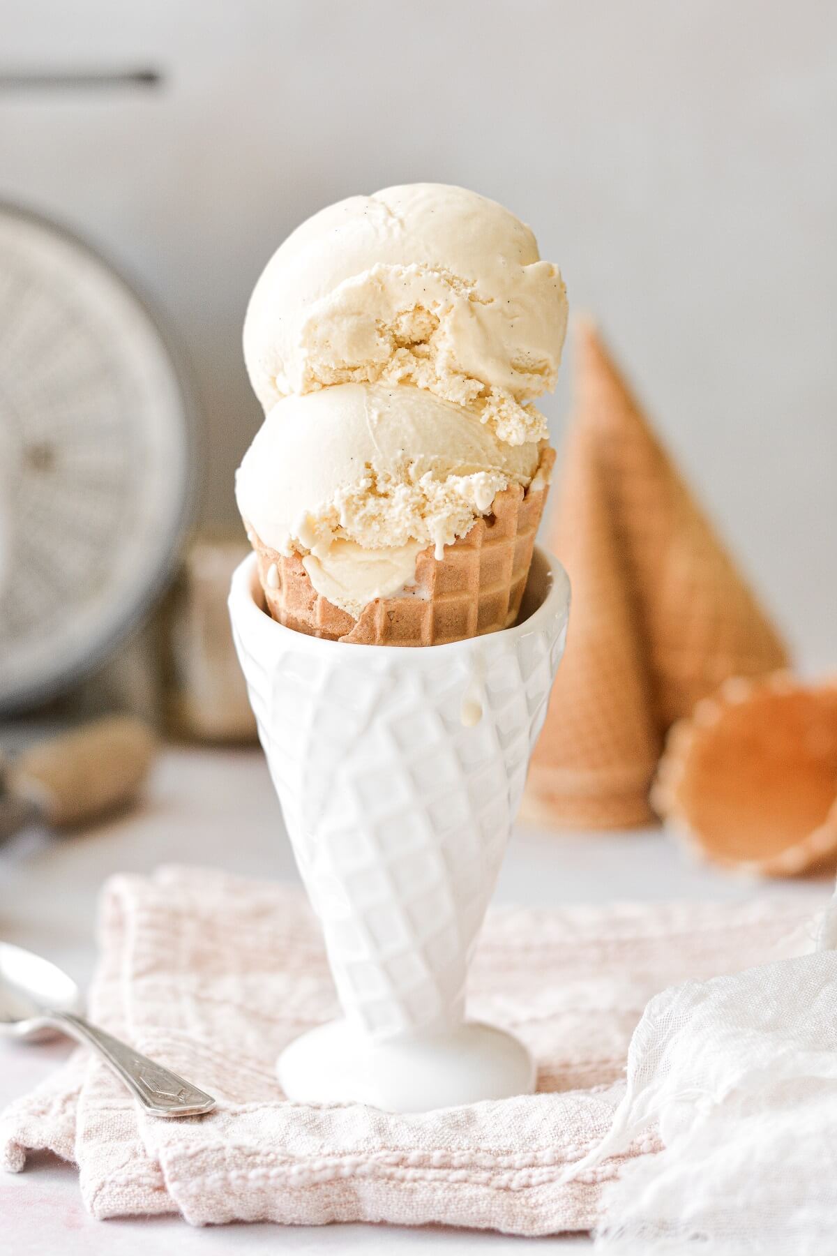 Vanilla bean ice cream in a waffle cone.
