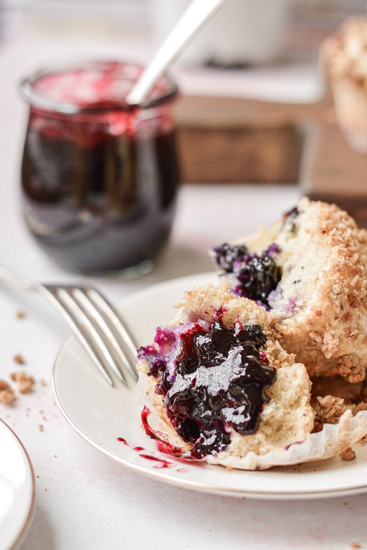 Blueberry muffins, spread with blueberry jam.