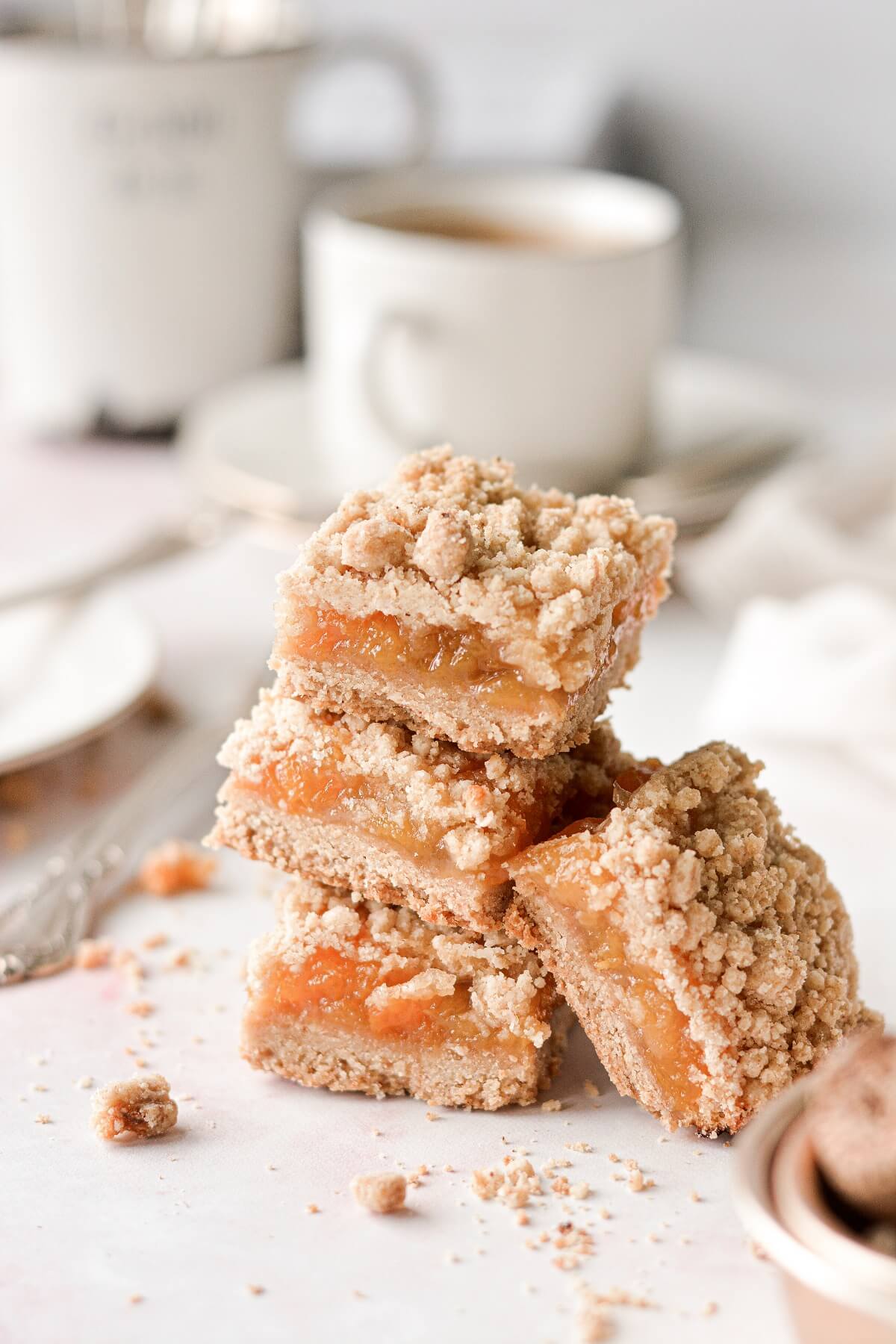 A stack of brown butter peach crumb bars.