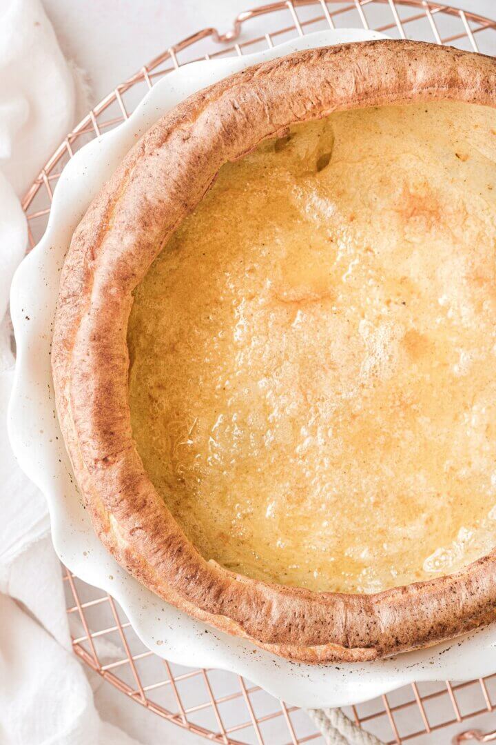A freshly baked Dutch baby pancake with poufed edges.