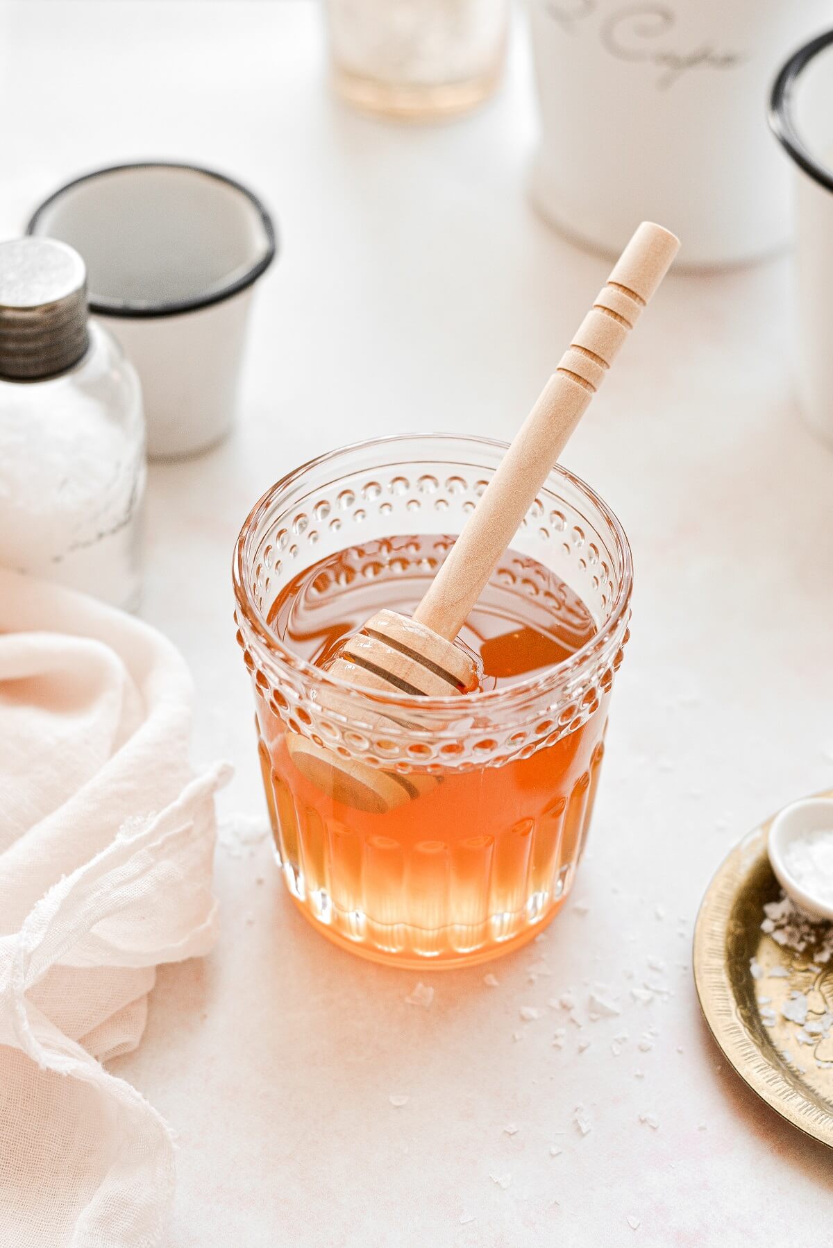 A glass jar filled with honey.