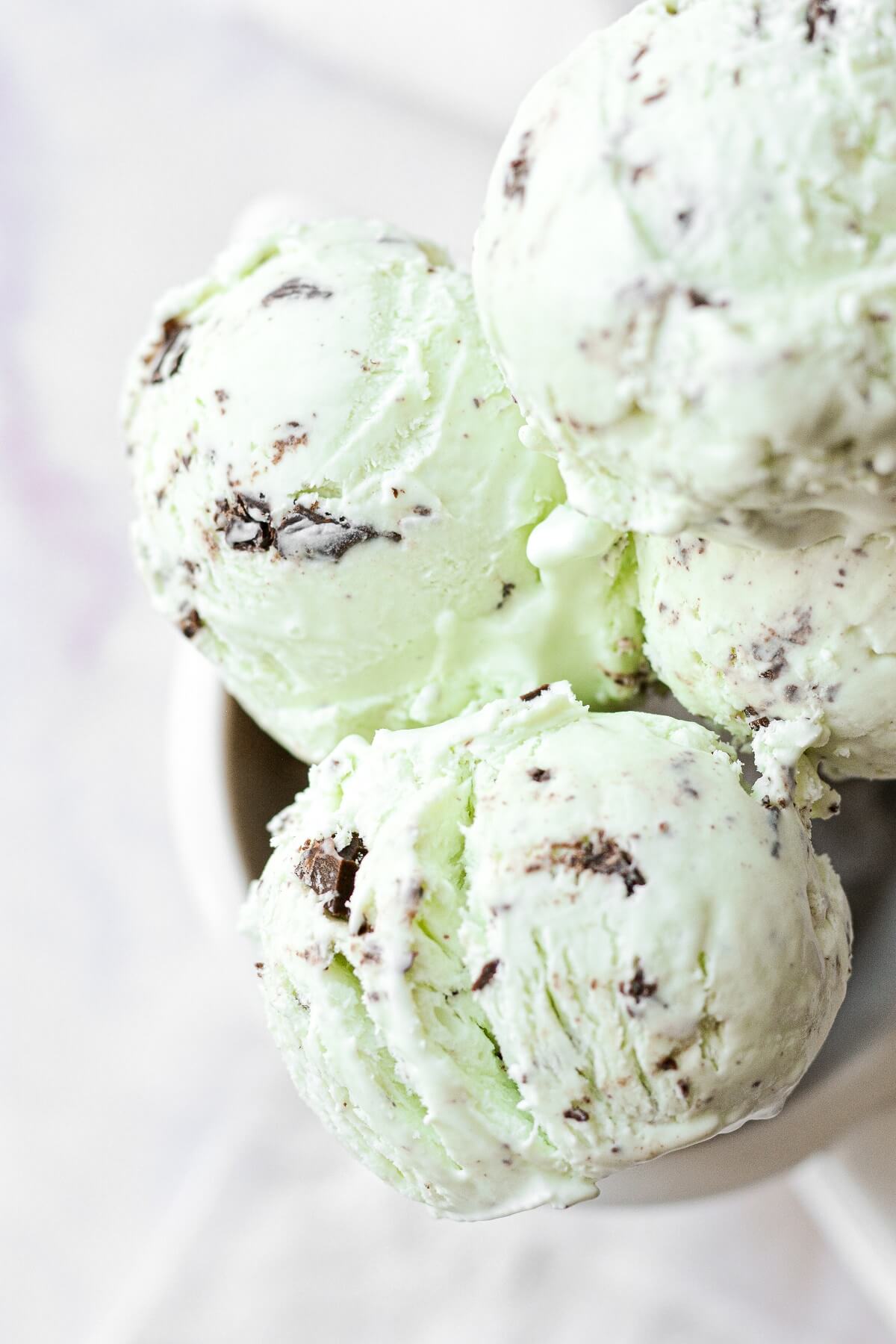 Closeup of scoops of mint chocolate chip ice cream.