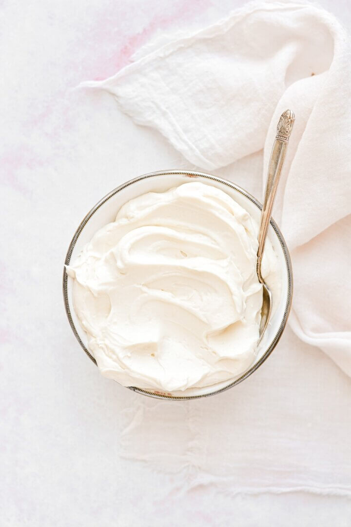 A bowl of cream cheese frosting.