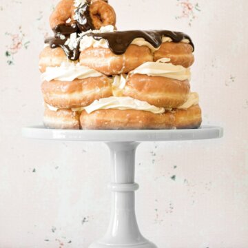 Doughnut cake, filled with custard, and topped with chocolate ganache.