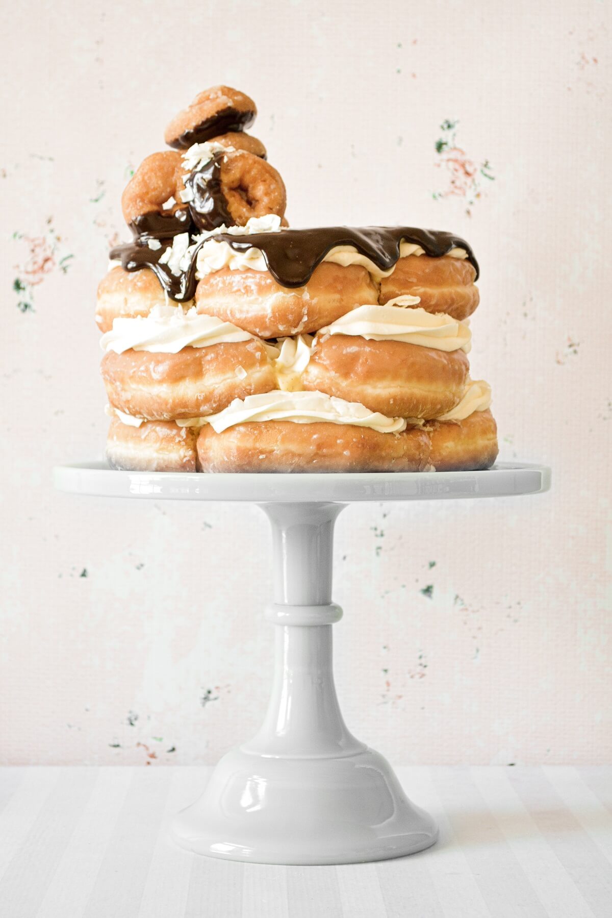 Doughnut cake, filled with custard, and topped with chocolate ganache.
