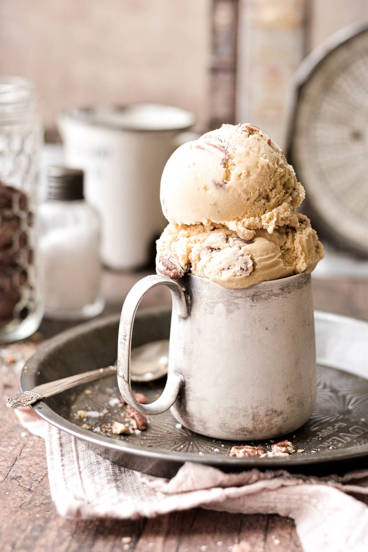 Butter pecan ice cream in a vintage silver cup.