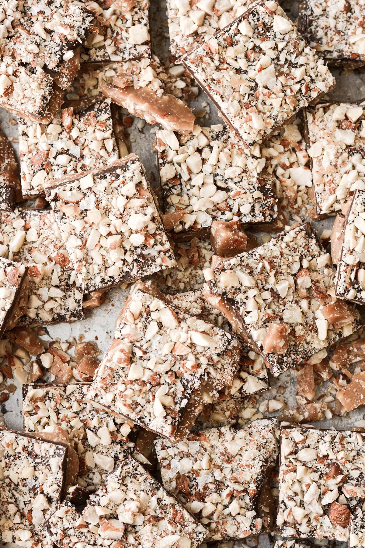 Squares of English toffee on a baking sheet.