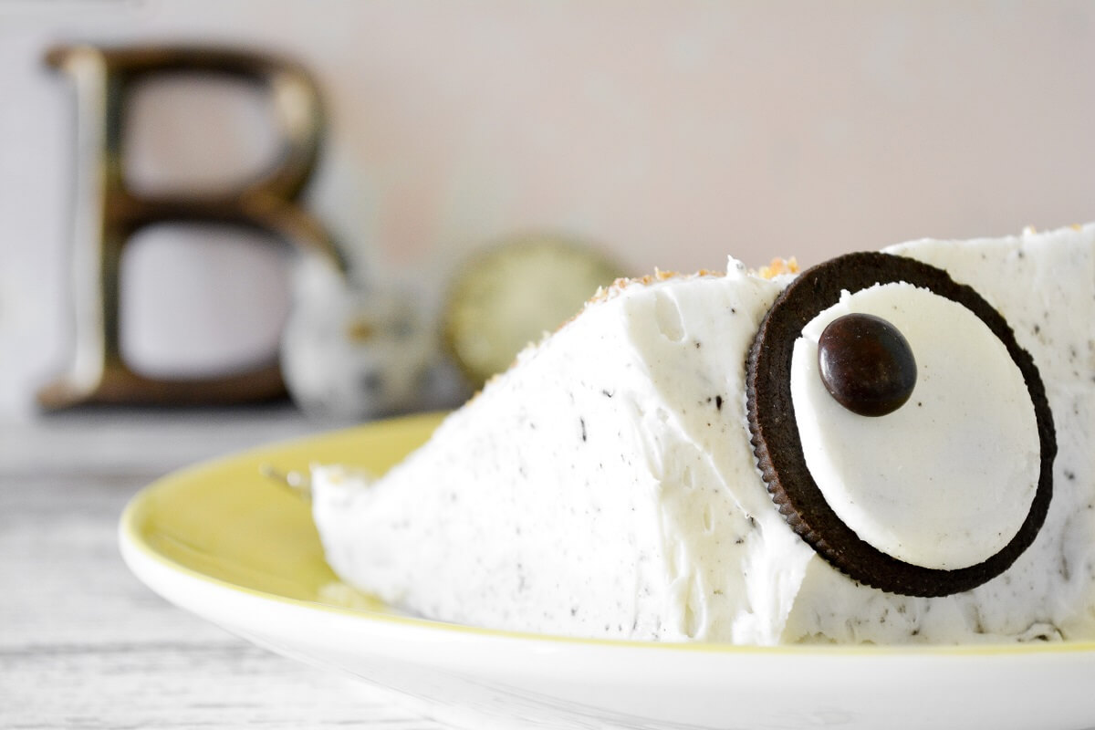 A slice of cake with an Oreo monster eye.