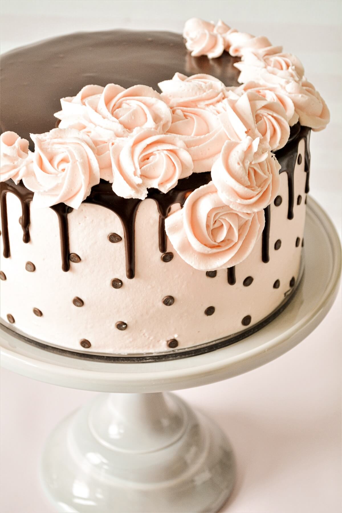 Buttercream roses on a polkadot drip cake.