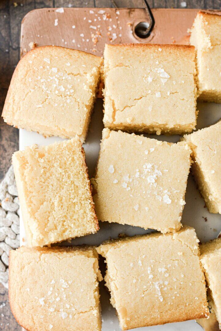 Squares of cornbread sprinkled with flaky salt.