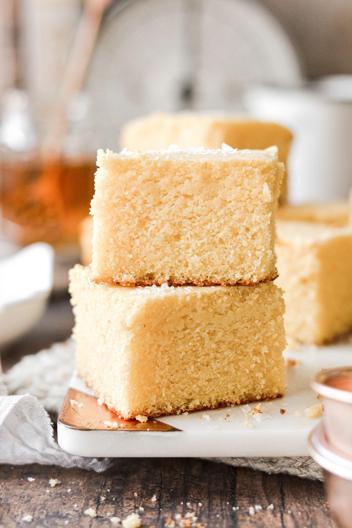 Two pieces of cornbread stacked on top of each other.