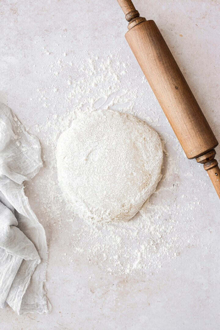 Dough ready to be rolled out on a floured board.