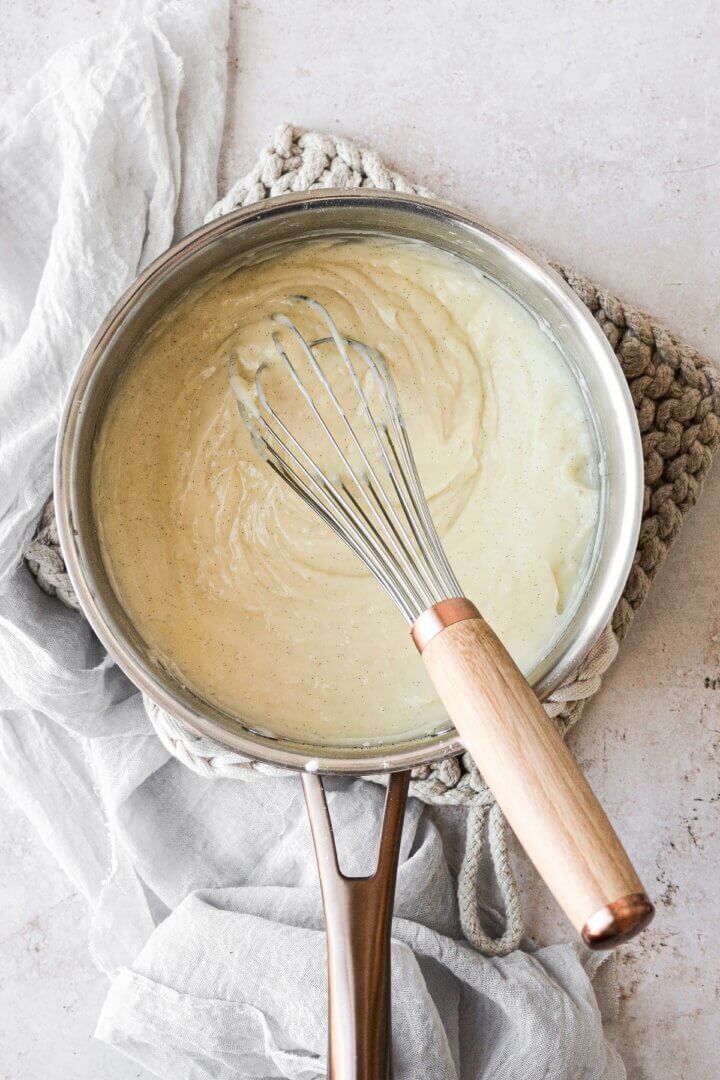 Vanilla bean custard in a saucepan.