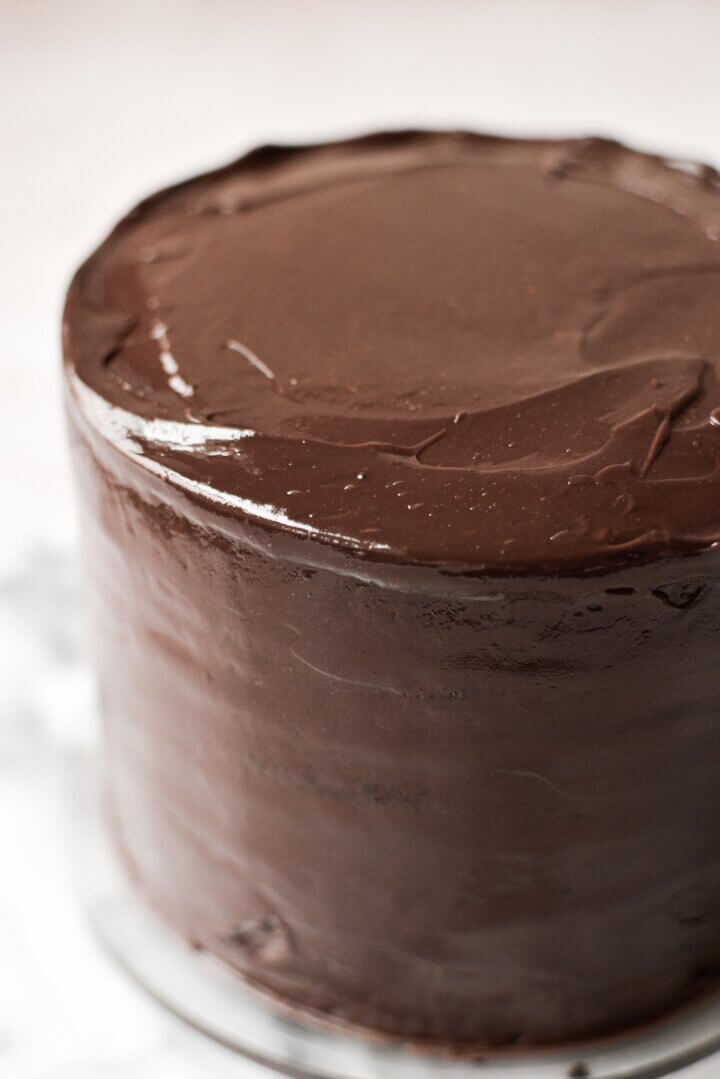 Chocolate ganache covering a chocolate cake.