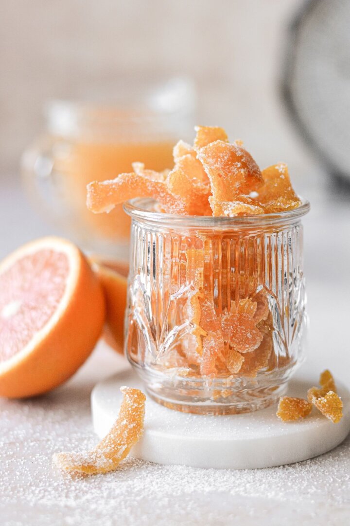 Candied orange peel in a glass jar.