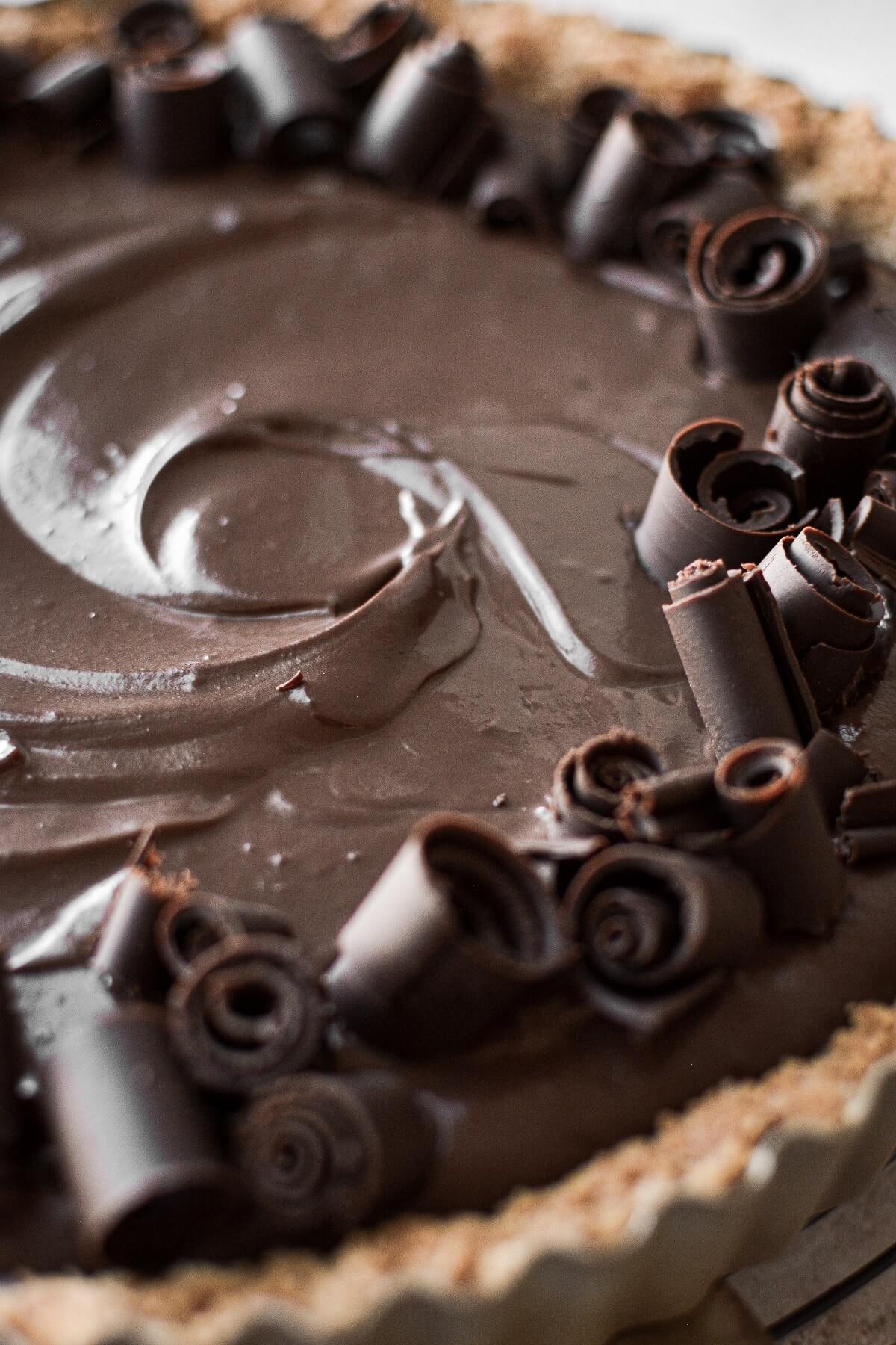 Closeup of chocolate curls on a chocolate cream pie.