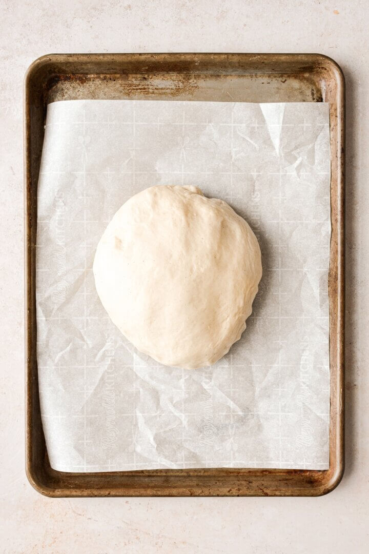 Dough ready to be rolled out on a baking sheet.