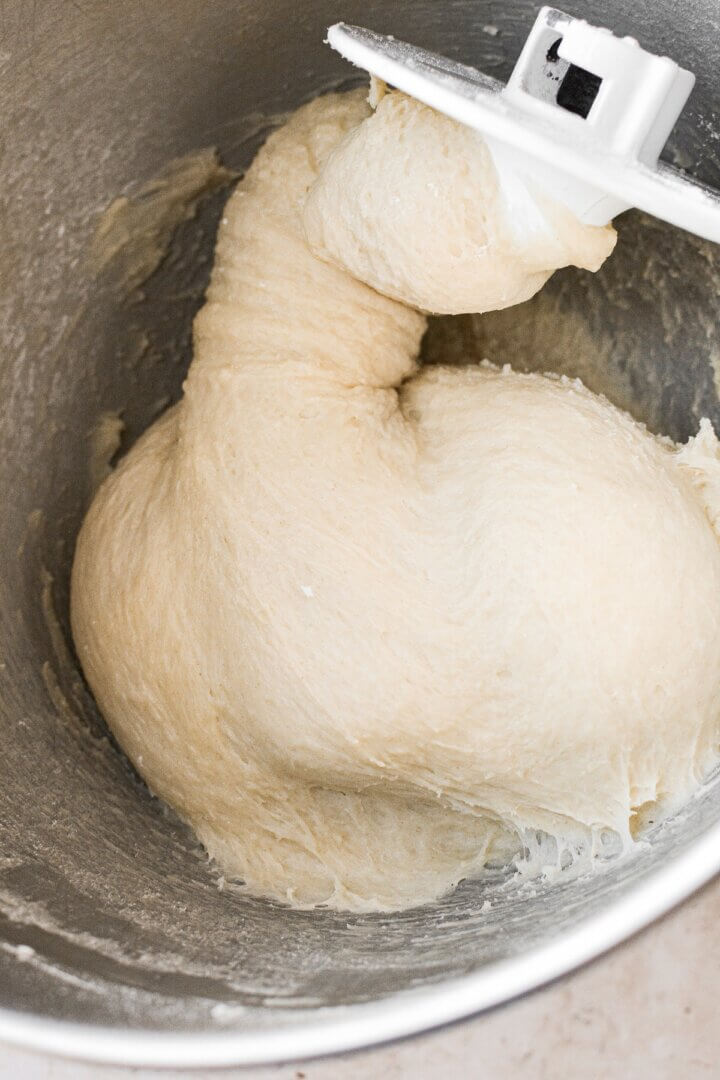 Milk bun dough in a mixing bowl.